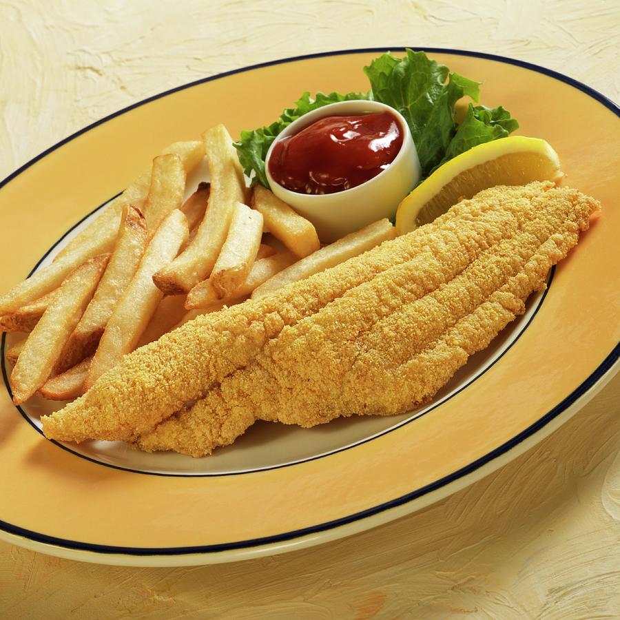 Catfish With A Cornflour Coating Served With Fries, Lemon