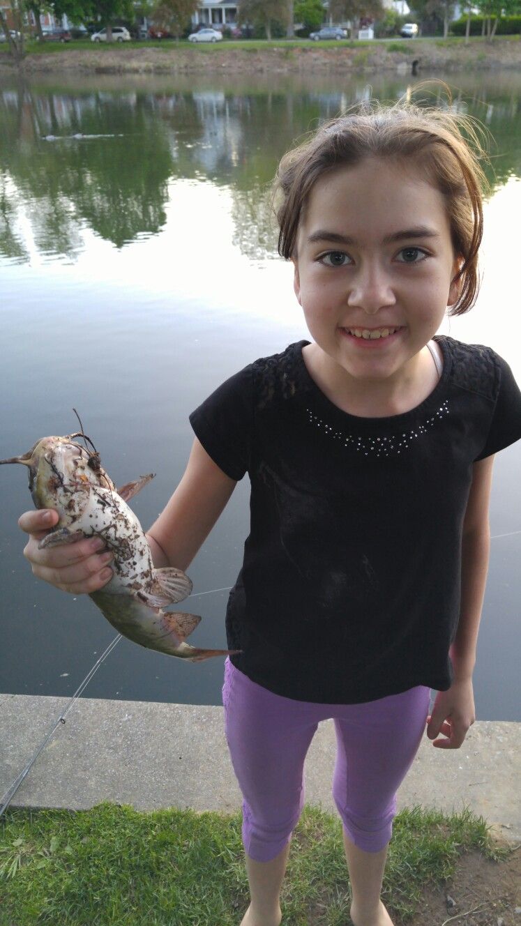 Shes holding a catfish for the first time Women, Photo